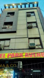 a building with a sign on the side of it at Hotel Park in Lucknow