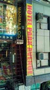 a store with a sign on the side of a building at Hotel Park in Lucknow