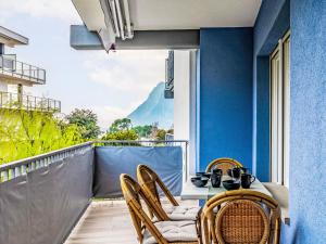 a patio with a table and chairs on a balcony at Apartment Ilaria by Interhome in Riva del Garda