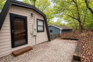 a house with a door on the side of it at A Frame Escape Lake Access in Rocky Mount
