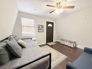 a bedroom with a bed and a ceiling fan at A Frame Escape Lake Access in Rocky Mount