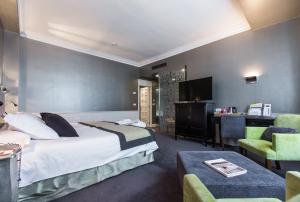Postel nebo postele na pokoji v ubytování Hotel Carlton