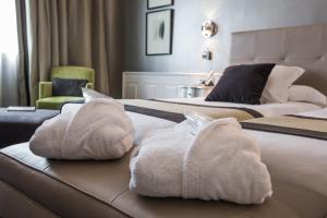 Postel nebo postele na pokoji v ubytování Hotel Carlton