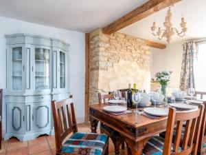 a dining room with a wooden table and chairs at 4 Bed in Gillingham oc-80670 in West Stour
