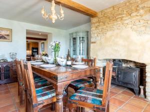 a dining room with a table and a fireplace at 4 Bed in Gillingham oc-80670 in West Stour +18 photos