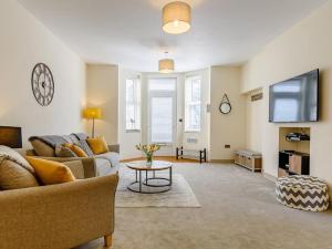 a living room with a couch and a table at 2 Bed in Shanklin oc-78239 in Shanklin