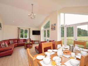 a living room with a table and a couch at 3 Bed in Rowlands Gill oc-cn209 in Rowlands Gill