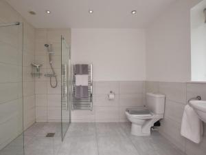 a bathroom with a shower and a toilet and a sink at 3 Bed in Rowlands Gill oc-cn209 in Rowlands Gill +14 photos
