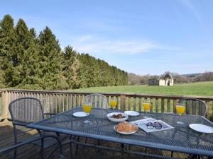 a blue table with food and drinks on a deck at 3 Bed in Rowlands Gill oc-cn209 in Rowlands Gill