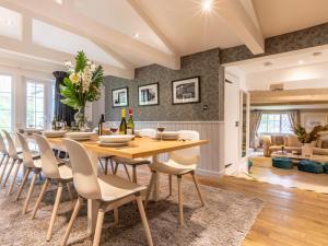 a dining room with a table and chairs at 6 Bed in Lymington oc-56765 in Boldre