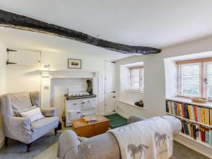 a living room with two chairs and a couch at 2 Bed in Dulverton oc-47152 in East Anstey