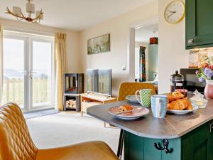 a kitchen with a table with food on it at 1 Bed in Sherborne oc-87292 in Lillington