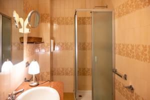 a bathroom with a shower and a sink at b&b casa pistacchio in Lovere +23 photos