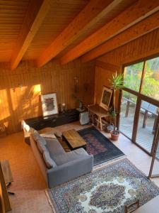 a large living room with a couch and a rug at Landscape Casa de Madera in Tarragona