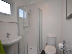 a bathroom with a shower and a toilet and a sink at 3 Bed in Bridgwater oc-56284 in Greinton +14 photos