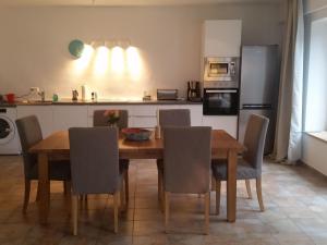 a kitchen with a wooden dining room table and chairs at Apartment Jacob by Interhome in Dölsach