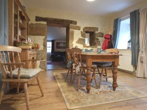 a dining room with a wooden table and chairs at 1 Bed in Newcastle Upon Tyne oc-49414 in Rochester