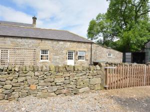 an old stone house with a stone fence at 1 Bed in Newcastle Upon Tyne oc-49414 in Rochester