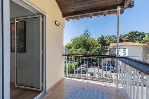 a balcony with a view of a parking lot at Carcavelos Village I by Staycalm in Carcavelos