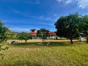 a building with trees in front of it at Flourish holiday resort in Kataragama
