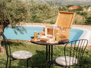 a table with food and a box on it at Wine Paradise - Glamping resort in Marezige +36 photos