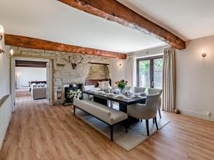 a dining room with a table and chairs at 5 Bed in Halifax oc-96061 in Sowerby Bridge