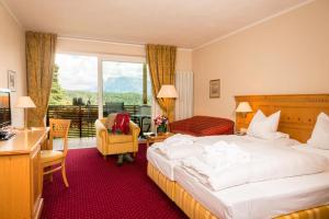 A bed or beds in a room at Hotel Regina