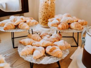 a bunch of pastries on display on a table at Hotel Villa Patriarca - Buongiorno! Hotels in Mirano