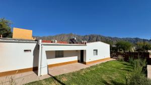 a white house with a view of the mountains at Complejo La Mística in Copacabana