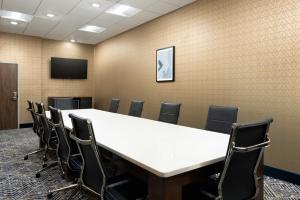 a conference room with a large table and chairs at Hyatt Select St Louis Airport in Saint Louis +31 photos