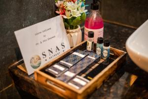 a box of skgas sitting on a counter next to a sink at Hotel SNAS Retreat Manali in Manāli +31 photos