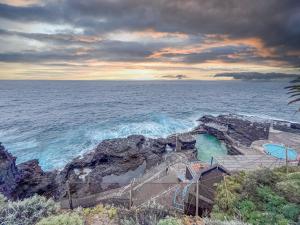a view of the ocean from a cliff at GuestReady - Refugio de Salome in Los Sauces