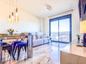 a kitchen and living room with a couch at Studio Justina by Interhome in L'Ampolla