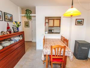 a kitchen and dining room with a table and chairs at Apartment Sa Guilla by Interhome in Pals