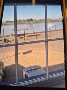 a view of a beach from a window at 8 River view in King's Lynn