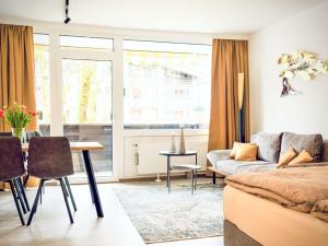 a living room with a couch and a table at Apartment Grubhof by Interhome in Scheffsnoth