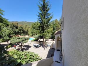 an external view of a house with a pool and trees at Villa Palama in Marseille