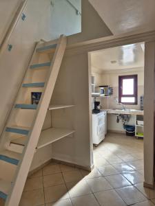 a staircase in a room with a kitchen at Terre d'Océan in Taghazout