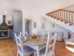 a kitchen and dining room with a table and chairs at Villa Can Gordei by Interhome in Albinyana