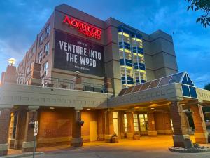 a building with a sign that says venture into the wood at Norwood Hotel in Winnipeg