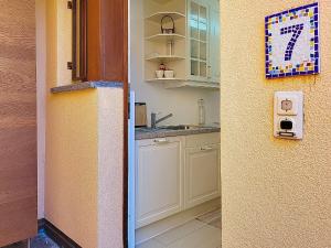 a kitchen with a sink and a counter at Apartment Vico Morcote Luxury View Apartment by Interhome in Morcote