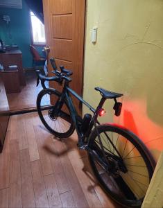 a bike parked against a wall in a room at 필모텔 in Yeoju