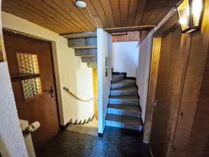 a hallway with a staircase in a house at Chalet Chalet Le Rhônasson by Interhome in Vercorin +65 photos