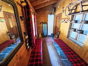 an inside view of a train room with a plaid rug at Chalet Chalet Le Rhônasson by Interhome in Vercorin