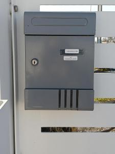 a metal box on a refrigerator with a door at Suite Fronte Mare Senigallia- Terrazza Esclusiva sulla Spiaggia in Senigallia