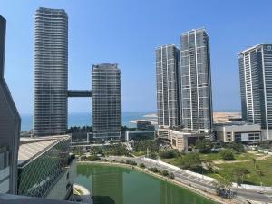 a view of a city with tall buildings at Cinnomon Life Residence Tower 20 3 in Colombo