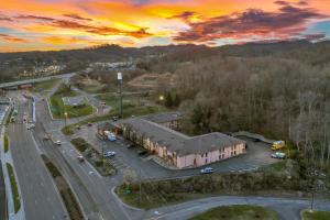 an aerial view of a parking lot with a building at Bristol Arcadia Inn in Bristol +16 photos