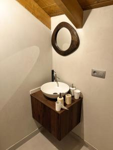 a bathroom with a sink and a mirror at Casa Rural A Costa - Villa Rustica Asturias - Boal in Boal