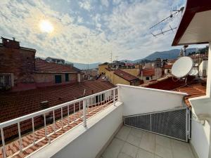 a balcony with a view of a city at BUDELLO Apartament in Alassio