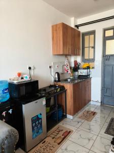 a kitchen with a sink and a counter top at Heritage Homes in Ruiru